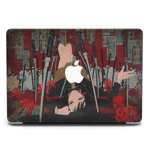 May include: A laptop skin with a red, black, and white design featuring a woman lying on a bed of swords. The woman has long black hair and is wearing a black and white outfit. The background is a red and white pattern.