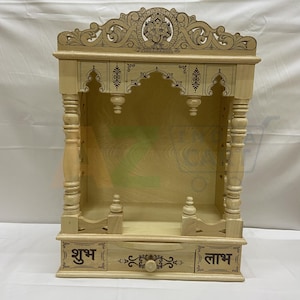 A beautifully crafted wooden Pooja Mandir provides a dedicated space for spiritual practices within your home. Pooja mandapam, pooja temple