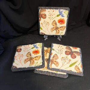 A Set of 4 Slate Coasters with a Butterfly Theme