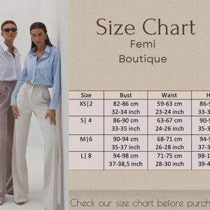 May include: Two women wearing button-down shirts and dress pants stand next to a size chart. The chart, labeled "Femi Boutique," lists bust, waist, and hip measurements in centimeters and inches for sizes XS to L.
