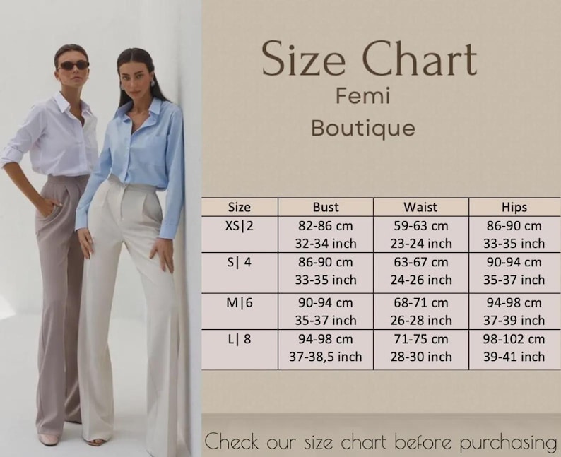 May include: Two women wearing button-down shirts and dress pants stand next to a size chart. The chart, labeled "Femi Boutique," lists bust, waist, and hip measurements in centimeters and inches for sizes XS to L.