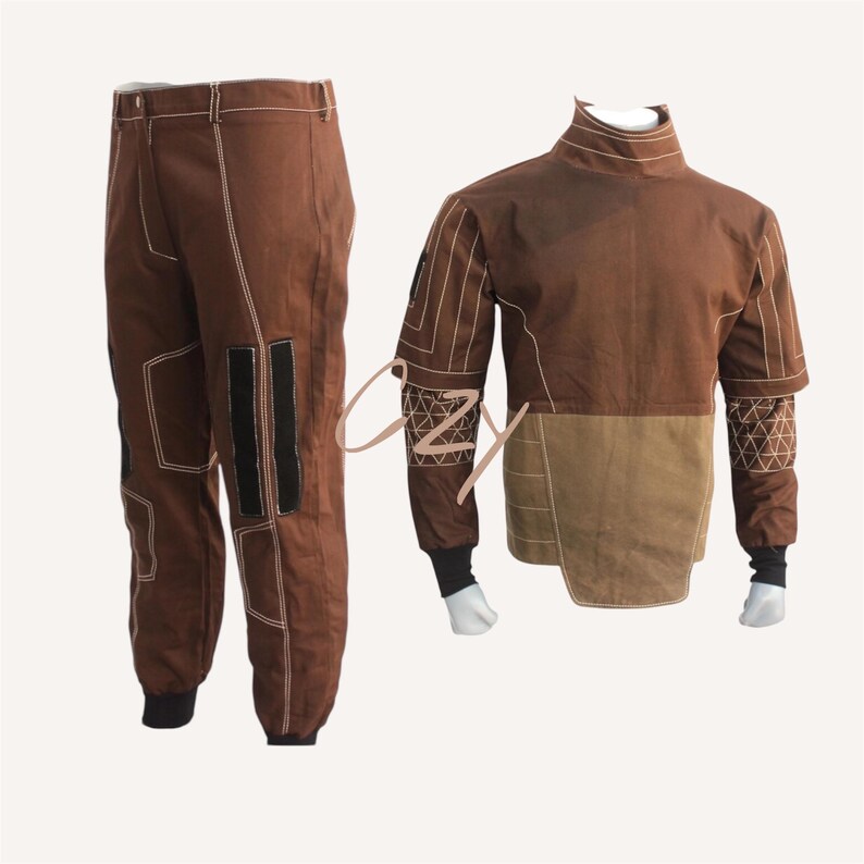 May include: A brown two-piece outfit featuring a jacket and pants. The jacket has a high collar, long sleeves, and a two-tone design with tan and brown panels. The pants are brown with white stitching and black patches.