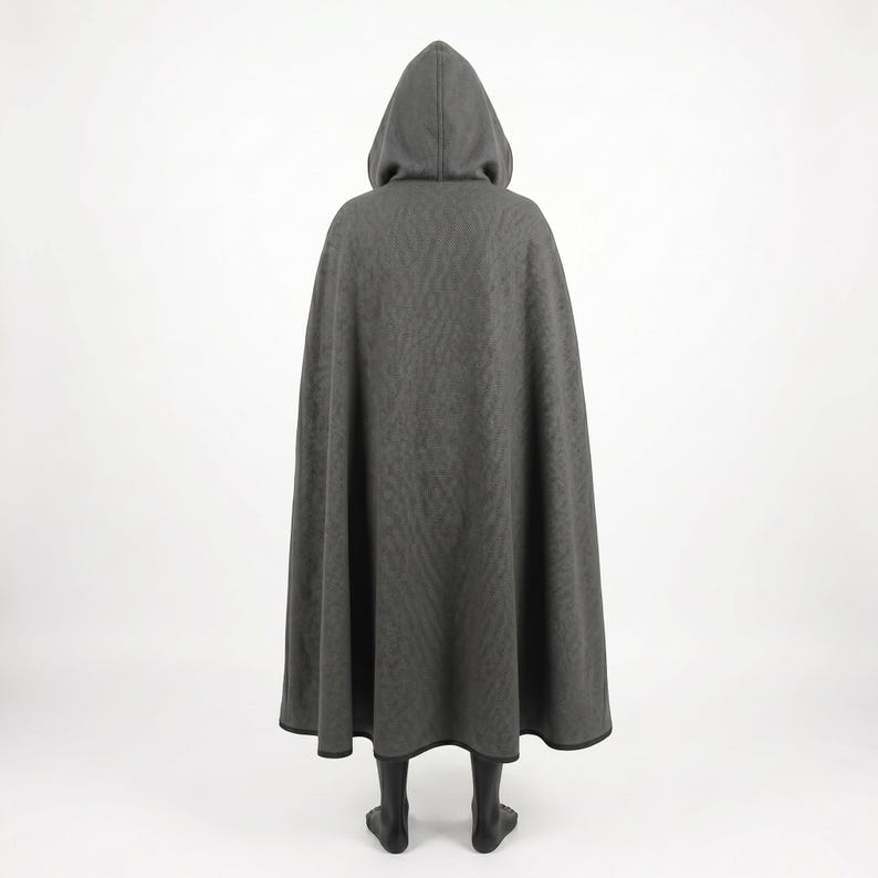 May include: A floor-length charcoal gray hooded cloak featuring a subtle, repeating tonal pattern across the fabric. The garment has a structured hood and a wide, flowing silhouette that extends to the hem, finished with a dark trim along the edge.
