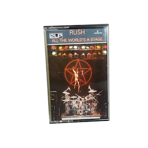 ラッシュ「All The World's A Stage」ヴィンテージカセット、1976年オリジナルレトロアナログテープカートリッジ、カナダの象徴的なアルバム、希少なコレクターズアイテム