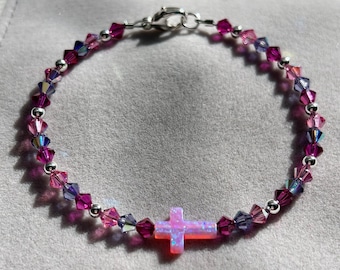 Pink cross charm bracelet with pink, purple Swarovski crystals and sterling silver accents; pink opal cross charm bracelet