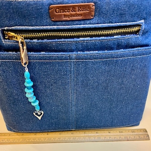 bolso de mezclilla con asa de cuero