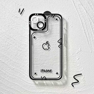 May include: A clear phone case featuring a black outline design with the word iPhone printed in black text. The case includes a black camera module border, a central black Apple logo, and small black cross symbols scattered across the surface.