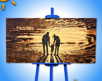 Art de la silhouette familiale gravée au soleil : scène de plage brûlée par l'énergie solaire