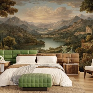 May include: A bedroom with a large mural of a landscape scene featuring mountains, a lake, and trees. The bed has a green headboard, white bedding, and a green ottoman. There are two wooden nightstands and a white armchair.