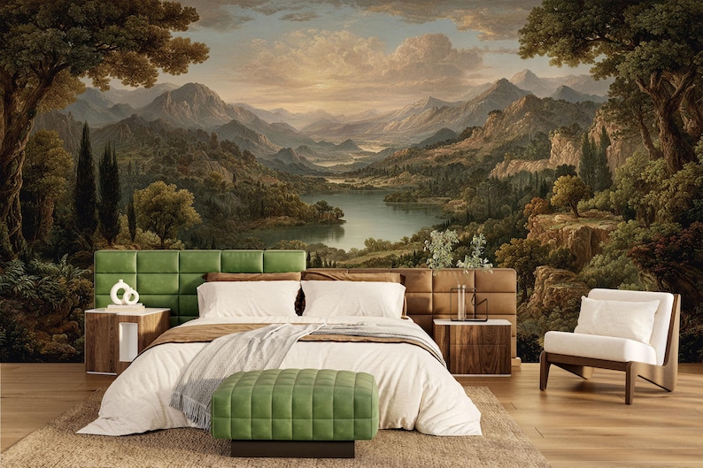 May include: A bedroom with a large mural of a landscape scene featuring mountains, a lake, and trees. The bed has a green headboard, white bedding, and a green ottoman. There are two wooden nightstands and a white armchair.