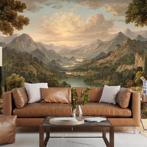 May include: A living room scene featuring a large landscape mural of mountains, a lake, and a sunset. A brown leather sofa with pillows is in front of the mural. A floor lamp, coffee table, and side table complete the room's decor.