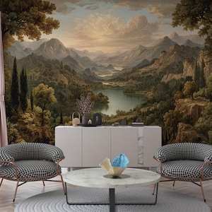 May include: A room featuring a scenic landscape mural with mountains, a lake, and trees. Two black and white checkered armchairs with copper-colored frames face the mural. A round marble coffee table and a white cabinet complete the decor.