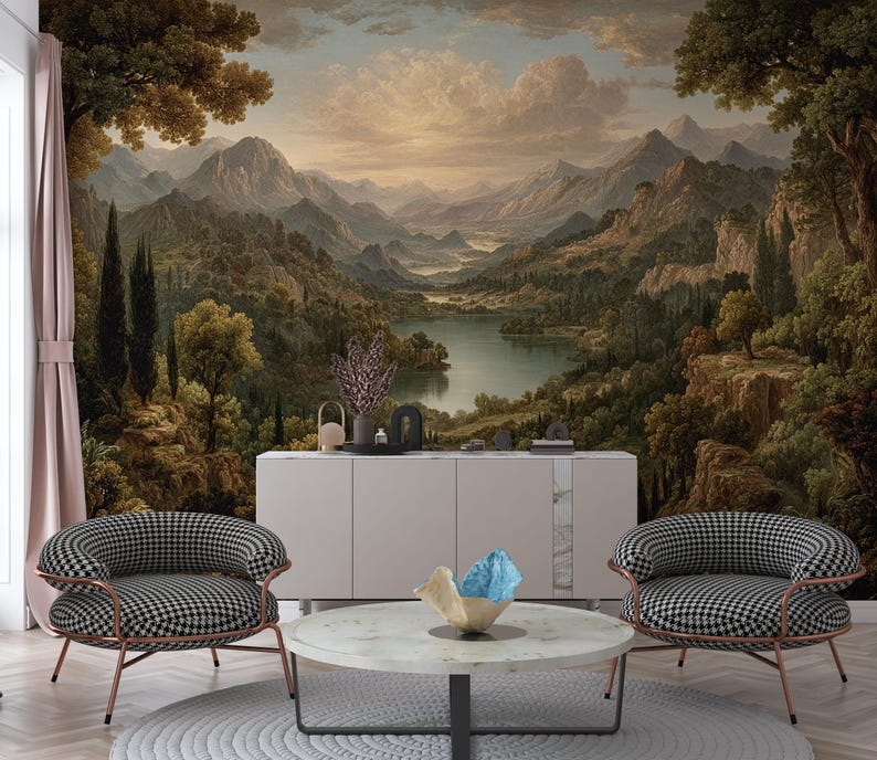 May include: A room featuring a scenic landscape mural with mountains, a lake, and trees. Two black and white checkered armchairs with copper-colored frames face the mural. A round marble coffee table and a white cabinet complete the decor.
