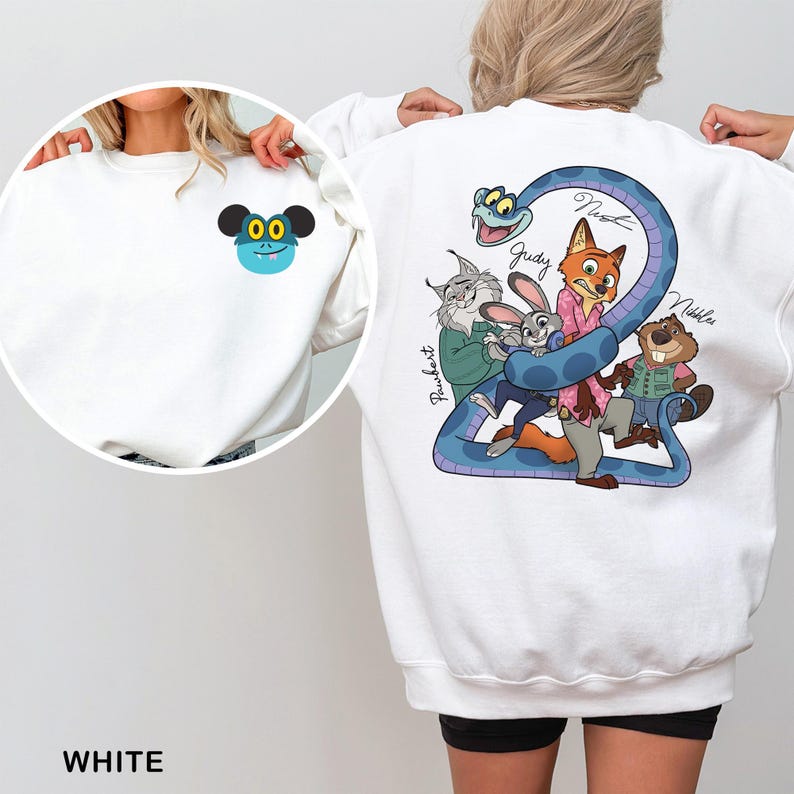 May include: White sweatshirt featuring a cartoon design on the front and back. The front has a blue and black cartoon character. The back has a blue snake with cartoon characters and names. The word "WHITE" is at the bottom.