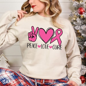 Peace Love Cure Sweatshirt, Breast Cancer Awareness Sweatshirt, Cancer Ribbon Hoodie,Pink Ribbon Hoodie, Breast Cancer Month Crewneck 283510