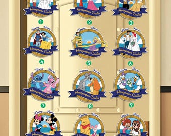 May include: Twelve circular magnets with cartoon characters and couples, each with a blue banner reading "Honeymoon Cruise" and space for a name. The magnets are displayed on a light-coloured door. The designs include various animated characters.
