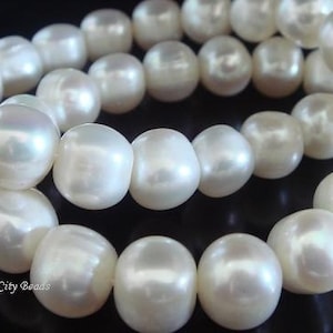 Natural Freshwater Pearls,  Large Ivory Round to Off Round Pearls- 8.5-9 mm