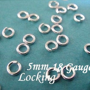May include: A close-up of a pile of silver 5mm locking jump rings. The rings are 18 gauge and are ideal for jewelry making.