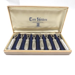 May include: A handmade, wooden serving tray with a natural finish. The tray features a rectangular shape with raised edges and integrated handles. Dimensions are approximately 16 inches long, 10 inches wide, and 2 inches high.