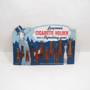 9 Zigarettenspitzen nos Vintage Amber Plastik auf Original Verkaufskarte