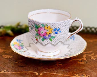 Juego de taza y platillo de té vintage de porcelana toscana - Diseño floral enrejado Art Déco, flores pintadas a mano, n.º de registro 785452, fabricado en Inglaterra