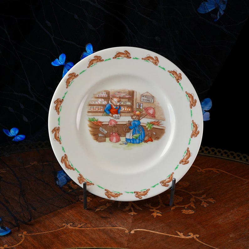 Vintage Royal Doulton Bunnykins Child's Plate – Mr Piggly's Stores Shop Scene, Running Rabbit Border, English Bone China Nursery Ware 1960s image 1