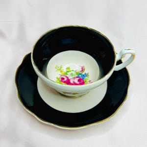 Vintage Foley Bone China Teacup and Saucer - Black with Gold Trim and Floral Center - Made in England (1948-1963)