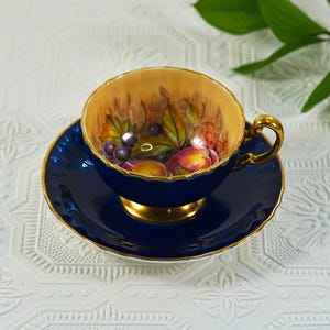 Vintage Aynsley Cobalt Blue Teacup and Saucer Set – Signed B. Jones Hand-Painted Fruit Interior with Gilt Trim, English Bone China 1950s