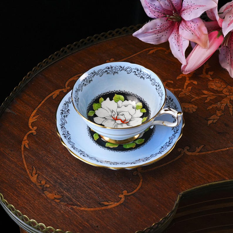 Vintage Paragon Gardenia Teacup & Saucer – White Bloom on Black, Powder Blue, Lucky Horseshoe Border, Double Royal Warrant, England 1940s image 1