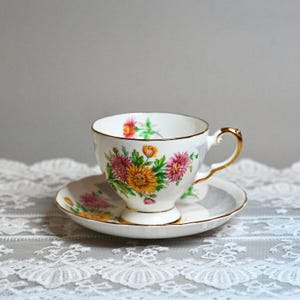 Vintage Tuscan Bone China Teacup Saucer Set – “Birthday Flowers” Chrysanthemum Pattern, Pink & Yellow Florals with Gray Lace, England 1950s