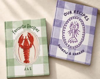 May include: Two hardcover recipe books with gingham covers. The green book features a red lobster illustration and the text Favorite Recipes A & H. The purple book features a purple lobster illustration and the text Our Recipes Andrew & Hannah.