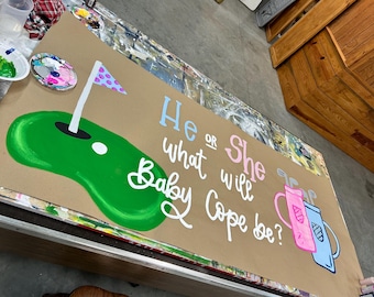 Golf themed gender reveal; pink or blue golf