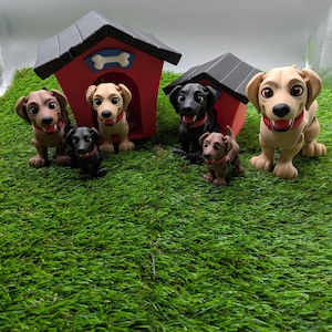 May include: Five toy dogs, including a black Labrador, two brown and white dogs, and two brown dogs, are standing in front of two red and black dog houses. The dogs are all wearing collars.