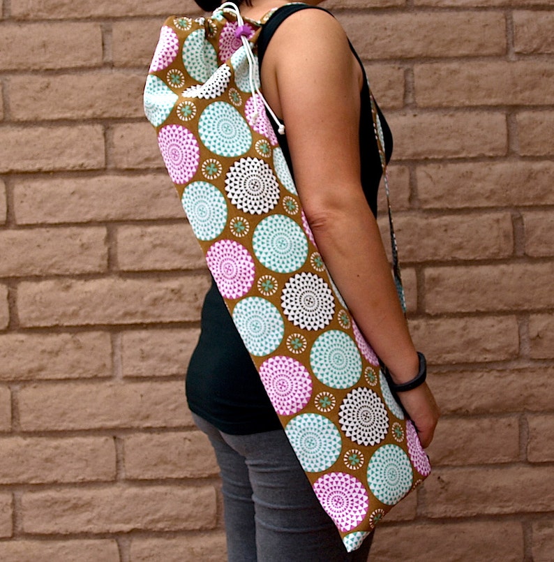 Yoga mat bag handmade with pocket in a neutral taupe with bursts of pink and light teal color in the shape of mums or pom poms BURST