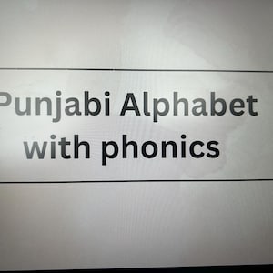 May include: A white rectangle with a black border contains the text "Punjabi Alphabet with phonics".