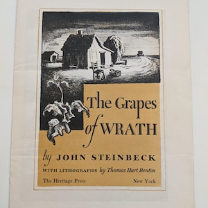 May include: A vintage book cover for "The Grapes of Wrath" by John Steinbeck. The cover features a black and white illustration of a rural scene with a house, tree, and text in a serif font. The Heritage Press, New York is also printed on the cover.