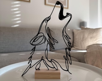 May include: Black metal wire sculpture of a wolf howling, mounted on a wooden base. The sculpture is a minimalist design with a single continuous line.