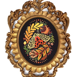 Tiger moth wall art in ornate vintage gold frame