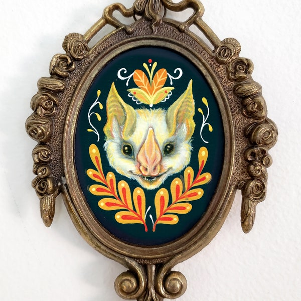 Golden bat wall art in vintage oval frame cute gothic decor