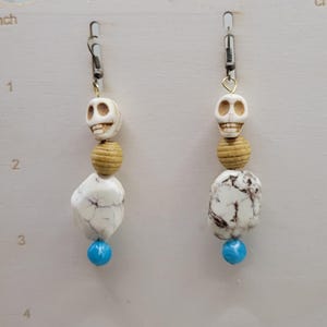 Neutral beaded skull earrings