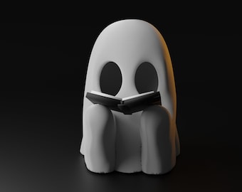 May include: A white ghost with black eyes is sitting and reading a black book.