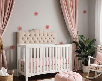 May include: A nursery with a white crib featuring a tufted headboard and a pink floral patterned sheet. The room is decorated with pink curtains, a floral rug, and a pink ottoman. Floral decals adorn the gray walls, creating a soft, inviting atmosphere.