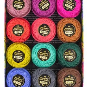 May include: A selection of WonderFil #8 Perle Cotton thread in a box, featuring a range of colours. The spools are neatly arranged and include pinks, purples, reds, oranges, yellows, greens, blues, greys, and browns. Each spool is labelled.