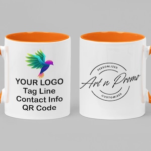 May include: Two white ceramic mugs with orange rims and handles. The mug on the left has a colorful bird logo and the text "YOUR LOGO Tag Line Contact Info QR Code". The mug on the right has a black circle with the text "PERSONALIZED Art n Promo CUSTOMIZED".