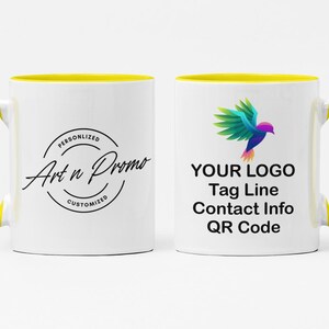 May include: White ceramic mug with a yellow rim and handle. The mug has a black logo that says "Art n Promo" with the words "Personalized" and "Customized" in smaller font. The other side of the mug has a colorful bird graphic and the text "YOUR LOGO, Tag Line, Contact Info, QR Code".