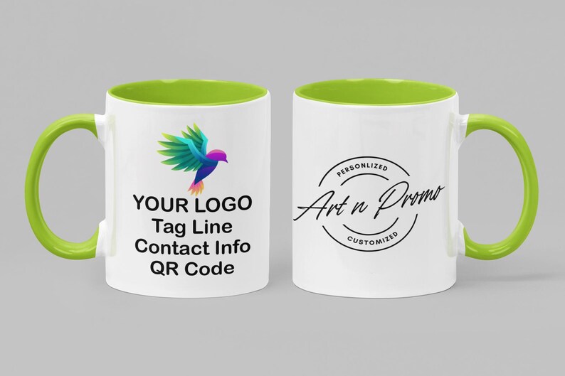 May include: A white ceramic mug with a green rim and handle. The mug has a colorful bird logo and the text "YOUR LOGO Tag Line Contact Info QR Code" on one side. The other side has a black circle with the text "PERSONALIZED Art n Promo CUSTOMIZED".