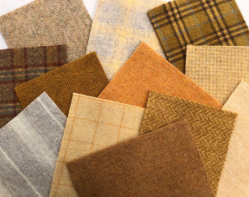 May include: Assortment of fabric swatches in various shades of brown, beige, and gray. The fabrics have different textures, including herringbone, plaid, and stripes.