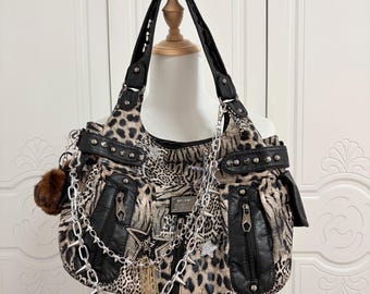 Punk Leopard Print Hobo Bag with Spikes, Star Charms, Chains, Fur Pom Pom & Studded Pockets - Edgy Rock Style Shoulder Handbag