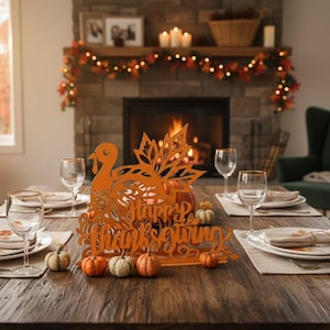May include: A wooden dining table set for Thanksgiving. The centerpiece is an orange turkey cutout with the words "Happy Thanksgiving." Small pumpkins and gourds are scattered around the centerpiece. Wine glasses and plates are set for each guest.