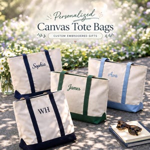 May include: Four canvas tote bags with personalized embroidered names. The bags are off-white with colored accents on the handles and base. The names "Sophia", "James", "Ava", and "WH" are embroidered on the bags. The text "Personalized Canvas Tote Bags" is at the top.